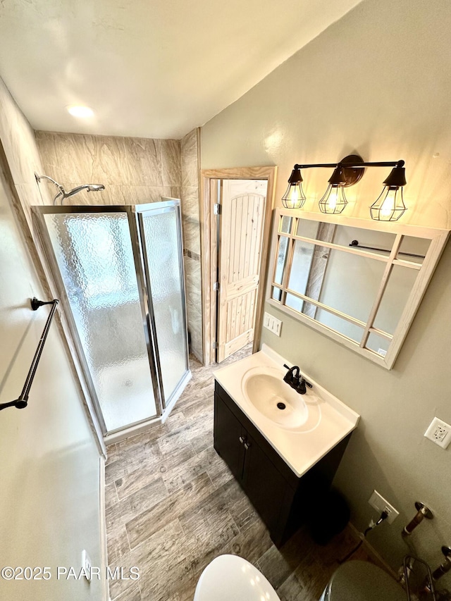 3702 E Pine Mountain Rd, Prescott, AZ 86303 - bathroom with vanity, wood finished floors, toilet, a shower stall, and vaulted ceiling