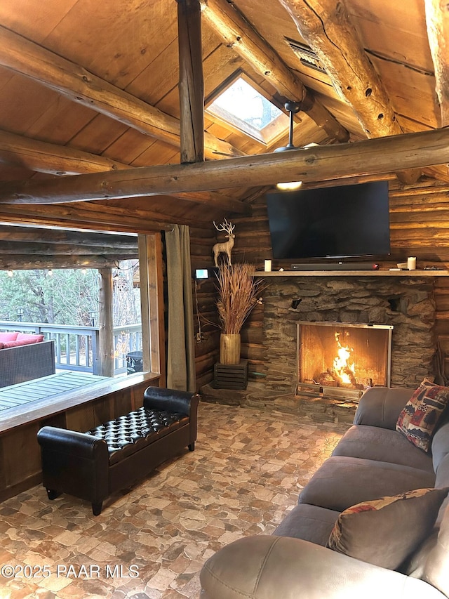 3702 E Pine Mountain Rd, Prescott, AZ 86303 - living room with vaulted ceiling with skylight, stone finish flooring, a stone fireplace, wooden ceiling, and rustic walls