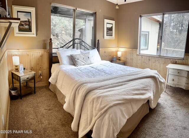 3702 E Pine Mountain Rd, Prescott, AZ 86303 - bedroom featuring wooden walls, wainscoting, and carpet floors