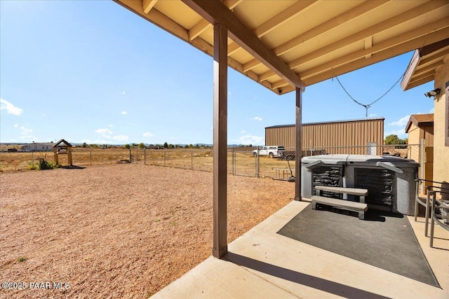 25690 N Burgundy Way, Paulden, AZ 86334 - view of patio / terrace featuring fence, a rural view, and a hot tub