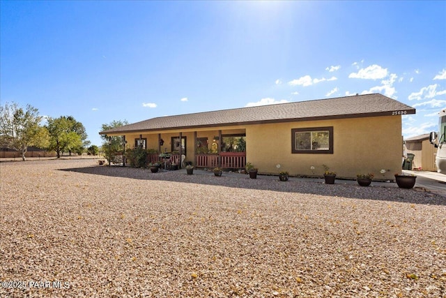 25690 N Burgundy Way, Paulden, AZ 86334 - rear view of property with stucco siding and covered porch