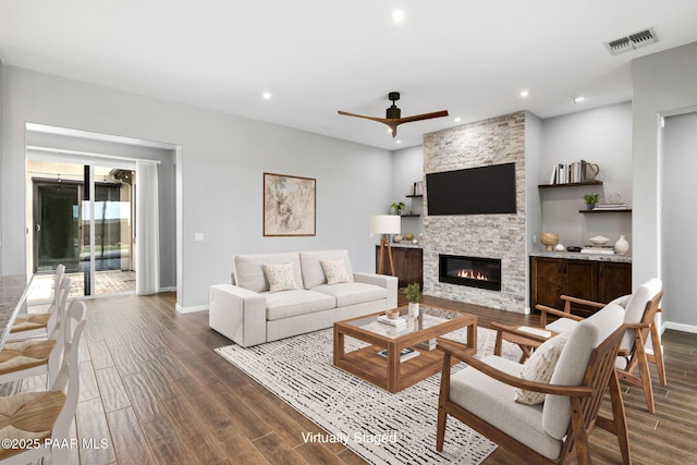 5357 Crescent Edge Dr, Prescott, AZ 86301 - living room with a stone fireplace, a ceiling fan, baseboards, dark wood-type flooring, and recessed lighting