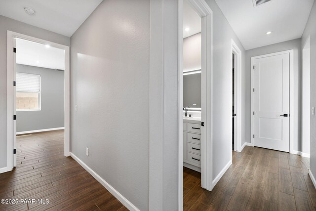 5357 Crescent Edge Dr, Prescott, AZ 86301 - corridor with dark wood-type flooring, baseboards, and a sink