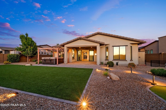 5357 Crescent Edge Dr, Prescott, AZ 86301 - back of house featuring a hot tub, a patio, and stucco siding