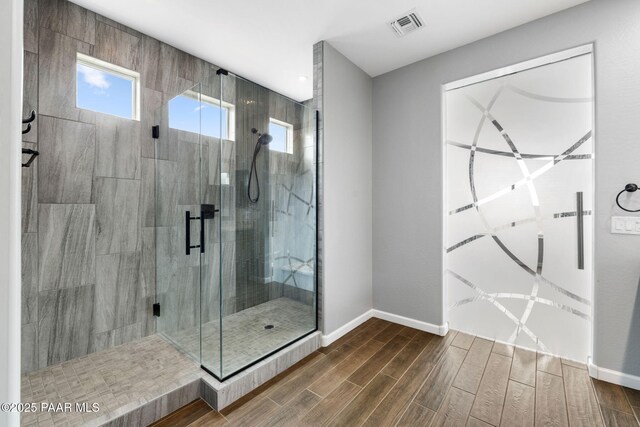 5357 Crescent Edge Dr, Prescott, AZ 86301 - bathroom with plenty of natural light, wood finished floors, a stall shower, and baseboards