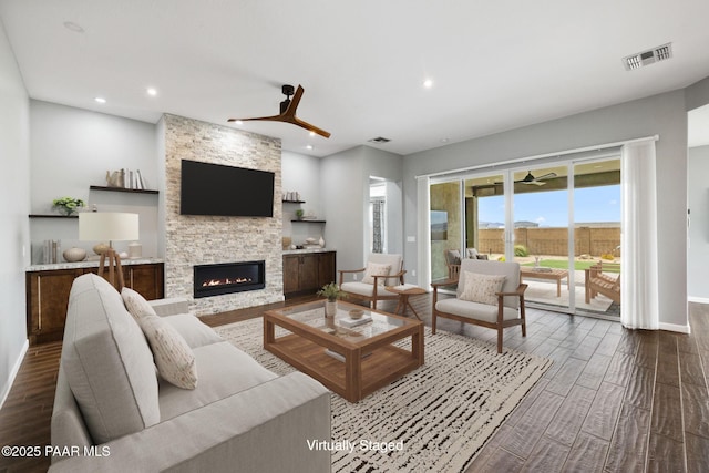 5357 Crescent Edge Dr, Prescott, AZ 86301 - living area featuring ceiling fan, wood finished floors, a stone fireplace, and recessed lighting