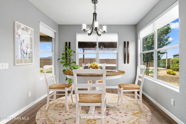 5357 Crescent Edge Dr, Prescott, AZ 86301 - dining area featuring a chandelier, wood finished floors, healthy amount of natural light, and baseboards