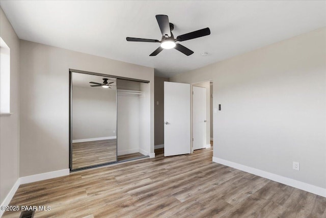 1287 N Lois Dr, Prescott, AZ 86301 - unfurnished bedroom with wood finished floors, a closet, and ceiling fan