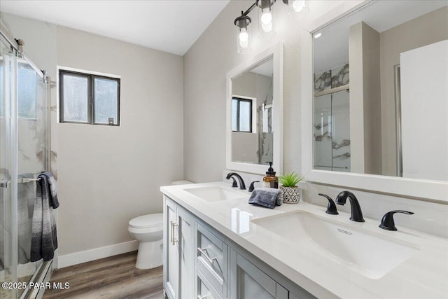 1287 N Lois Dr, Prescott, AZ 86301 - bathroom featuring a shower stall, double vanity, plenty of natural light, and wood finished floors