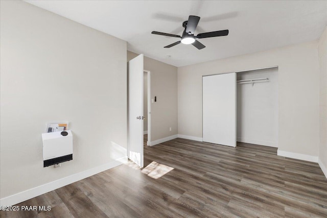 1287 N Lois Dr, Prescott, AZ 86301 - unfurnished bedroom featuring wood finished floors, a closet, a ceiling fan, and heating unit