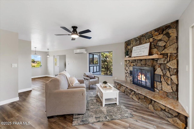 1287 N Lois Dr, Prescott, AZ 86301 - living area with plenty of natural light, a wall mounted AC, a ceiling fan, and wood finished floors