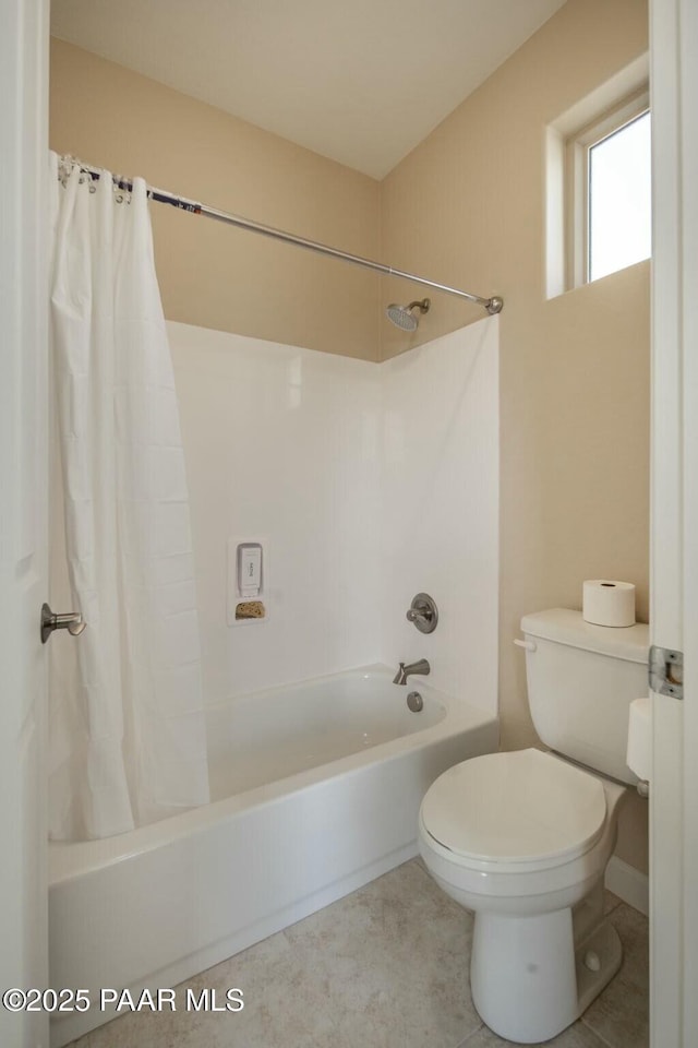 bathroom featuring toilet and shower / bathtub combination with curtain