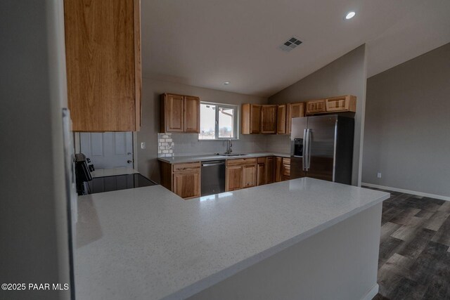 kitchen featuring ceiling fan, sink, stainless steel fridge with ice dispenser, high vaulted ceiling, and dark hardwood / wood-style floors