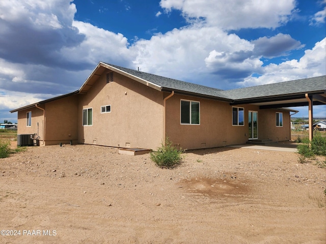 back of house featuring a patio area and central air condition unit