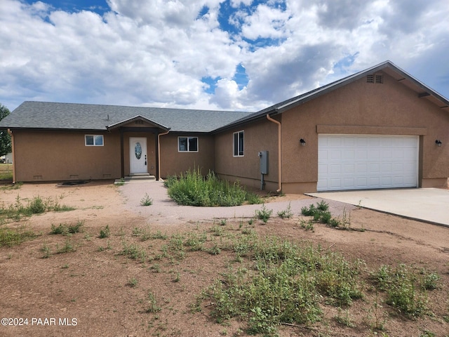 single story home featuring a garage