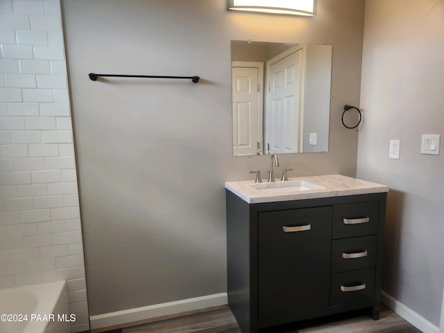 bathroom with hardwood / wood-style flooring and vanity