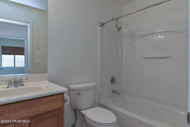 full bathroom with vanity,  shower combination, and toilet