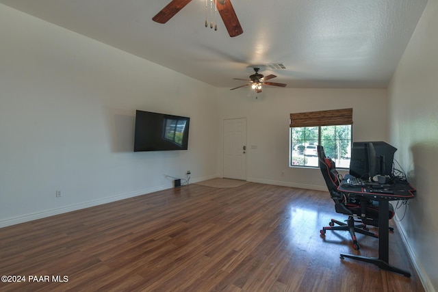 office space featuring ceiling fan, dark hardwood / wood-style floors, and lofted ceiling