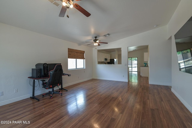 home office with dark hardwood / wood-style flooring, plenty of natural light, and ceiling fan