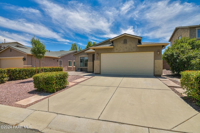 ranch-style home featuring a garage