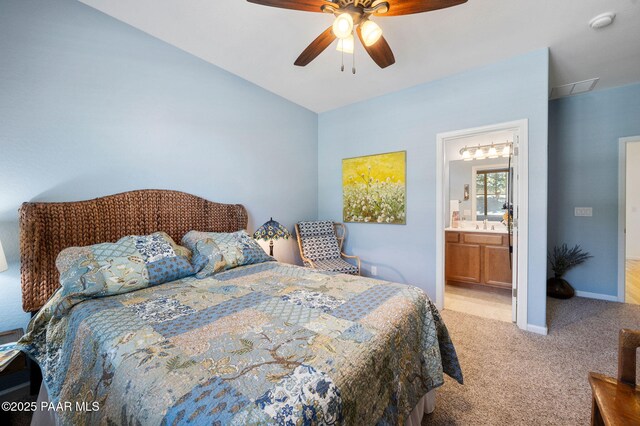 1147 N Lucky Draw Dr, Prescott Valley, AZ 86314 - bedroom featuring light carpet, a ceiling fan, baseboards, connected bathroom, and a sink