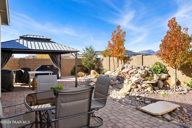 view of patio with a gazebo and a grill