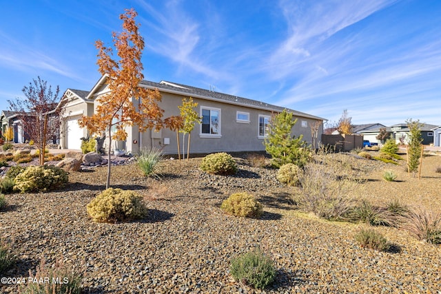 view of home's exterior with a garage