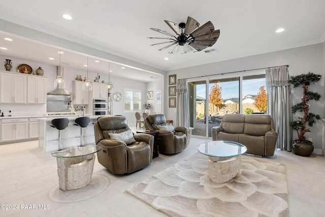 living room with light tile patterned flooring, ceiling fan, and crown molding