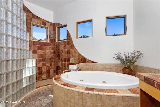 full bath with walk in shower and a whirlpool tub