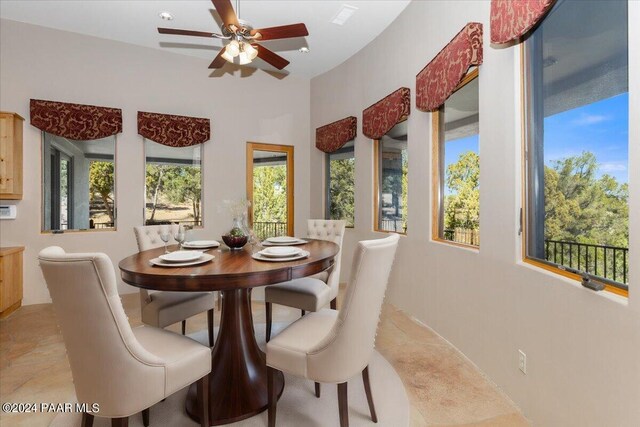 dining room featuring ceiling fan