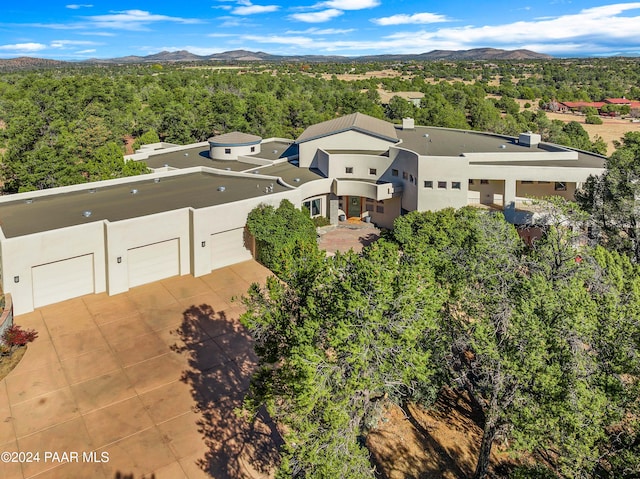 drone / aerial view featuring a mountain view