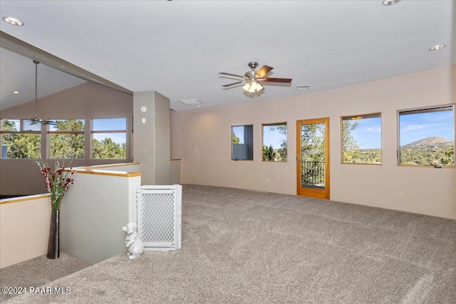 empty room with plenty of natural light, visible vents, a ceiling fan, and carpet floors