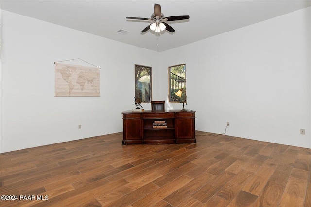 office area with visible vents, wood finished floors, and a ceiling fan