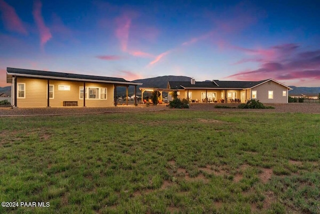 9820 N Echo Ridge Cir, Prescott Valley, AZ 86315 - back of property at dusk with a lawn