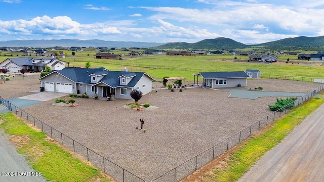 9820 N Echo Ridge Cir, Prescott Valley, AZ 86315 - view of front of home with driveway, a rural view, fence, and a mountain view