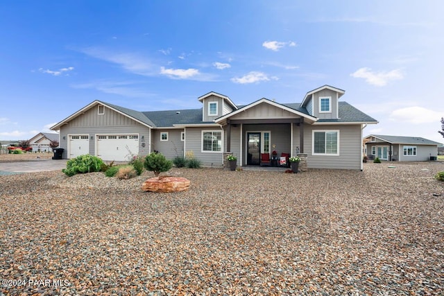 view of front of property featuring a garage, driveway, and board and batten siding