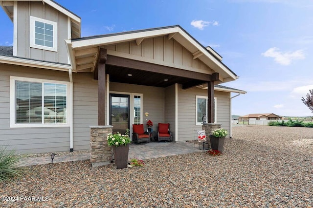 9820 N Echo Ridge Cir, Prescott Valley, AZ 86315 - back of house with board and batten siding and a patio area