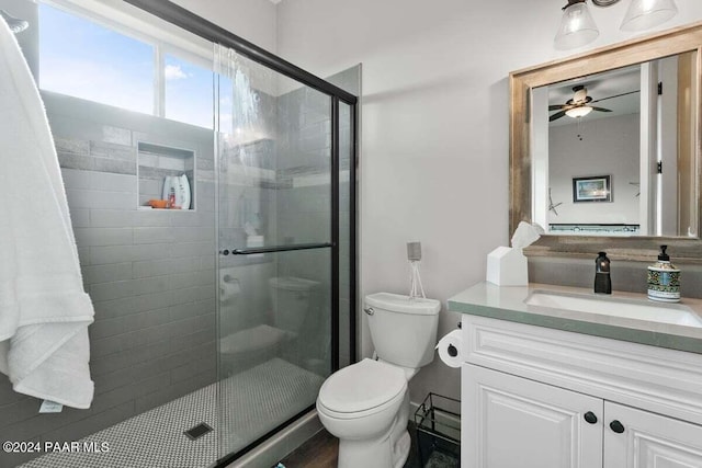 9820 N Echo Ridge Cir, Prescott Valley, AZ 86315 - bathroom featuring toilet, a stall shower, ceiling fan, and vanity