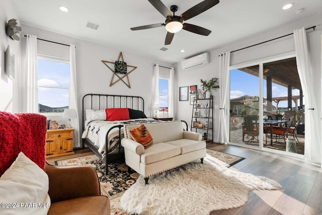 9820 N Echo Ridge Cir, Prescott Valley, AZ 86315 - bedroom featuring access to exterior, recessed lighting, visible vents, a wall mounted AC, and wood finished floors