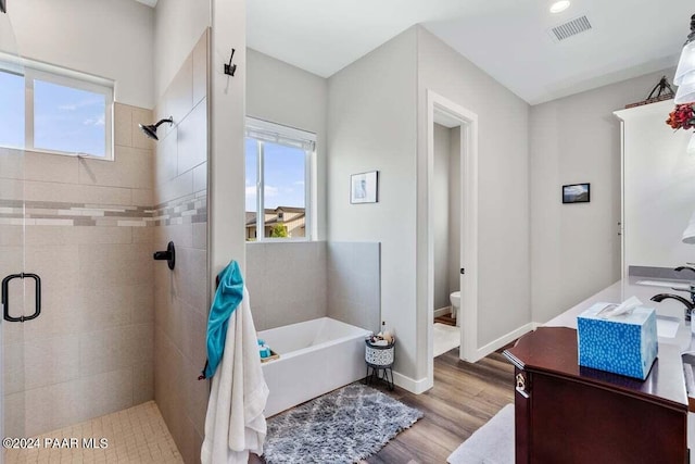 9820 N Echo Ridge Cir, Prescott Valley, AZ 86315 - full bath with toilet, a stall shower, visible vents, and wood finished floors