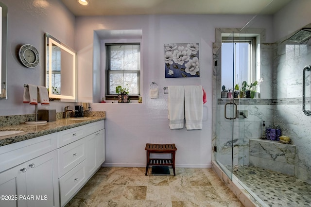 bathroom with vanity and an enclosed shower