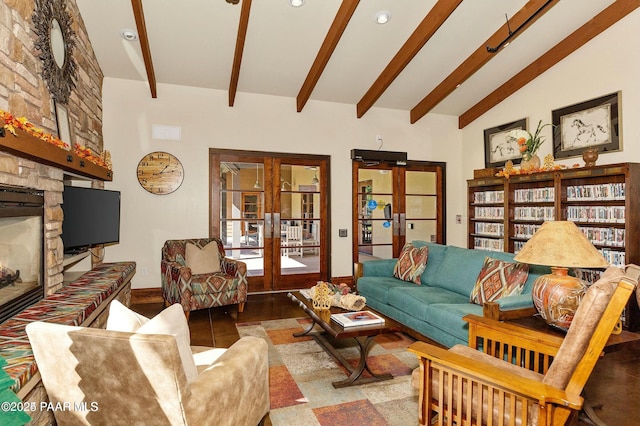 living room with french doors, a fireplace, and lofted ceiling with beams