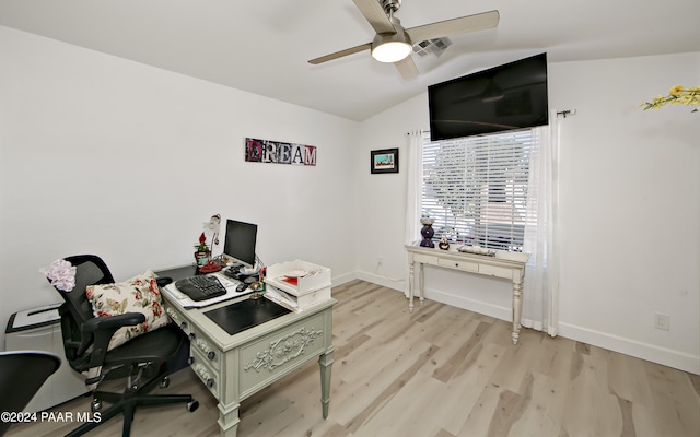 office with ceiling fan, light hardwood / wood-style flooring, and vaulted ceiling