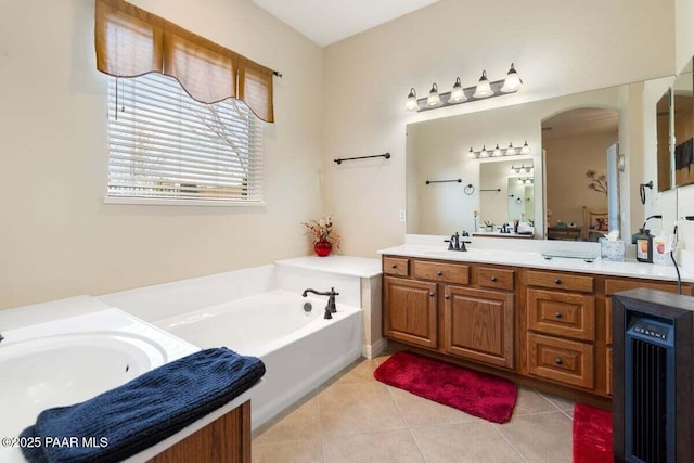 bathroom featuring tile patterned floors, a washtub, beverage cooler, and vanity