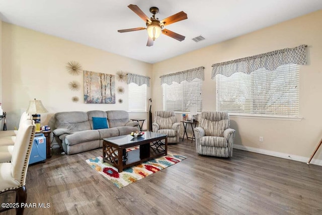 living room featuring ceiling fan and wood-type flooring