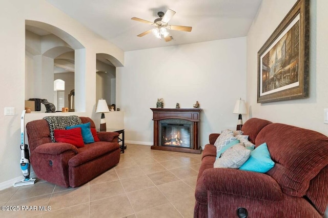 living room featuring ceiling fan and light tile patterned floors