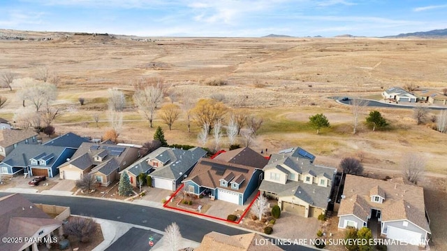 birds eye view of property featuring a mountain view