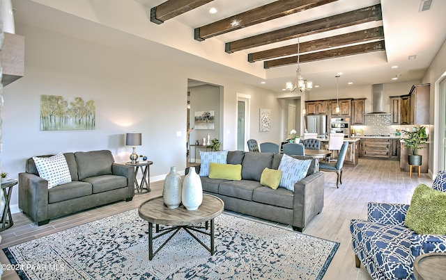 living room featuring beamed ceiling, recessed lighting, a notable chandelier, visible vents, and light wood-style flooring