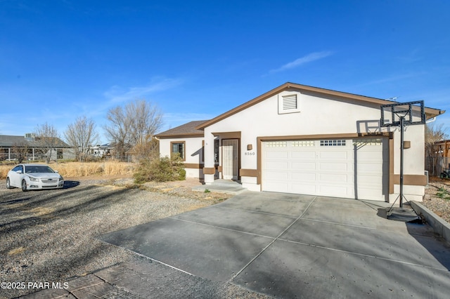 ranch-style house featuring a garage