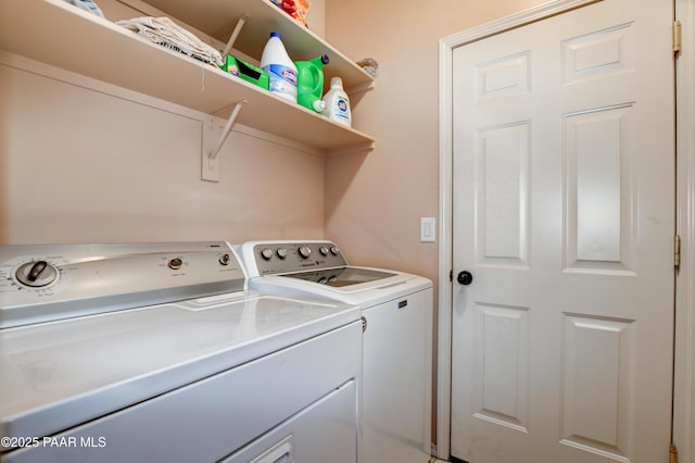 laundry area featuring washing machine and clothes dryer